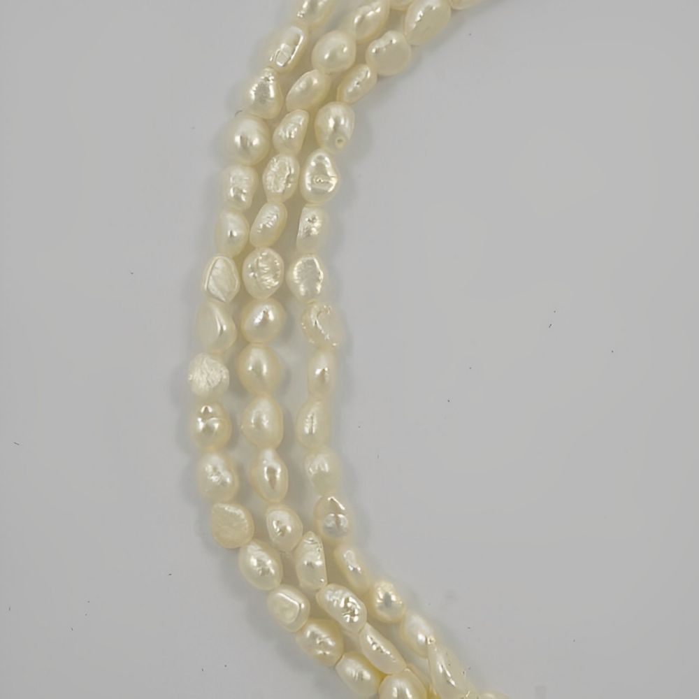 Three Strand Baroque Rice Pearl Necklace circa 1970s | Arabella Bianco